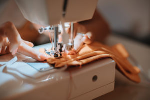 Woman sewing face mask for corona covid pandemic with sewing machine, Woman sewing face mask for corona covid pandemic with sewing machine,